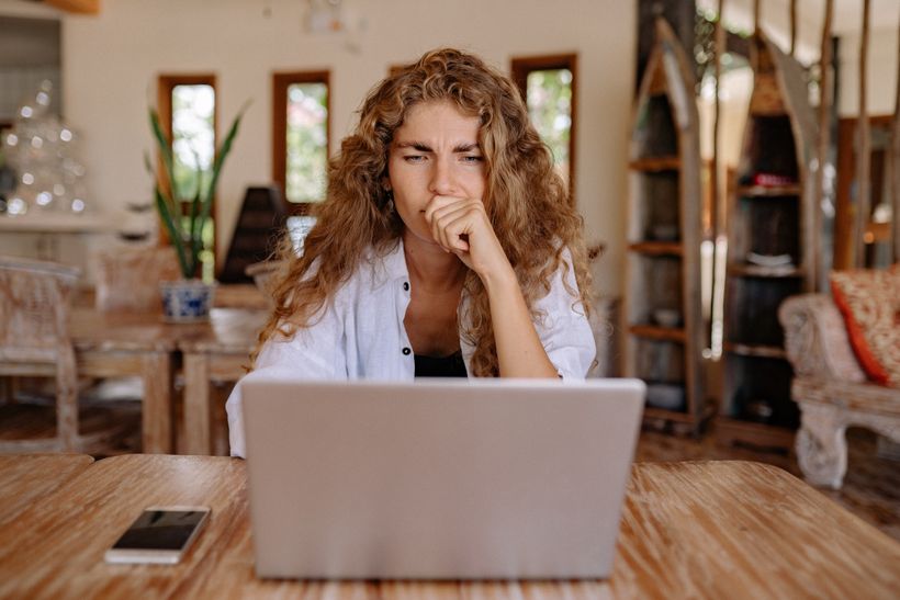 Tentative woman on laptop