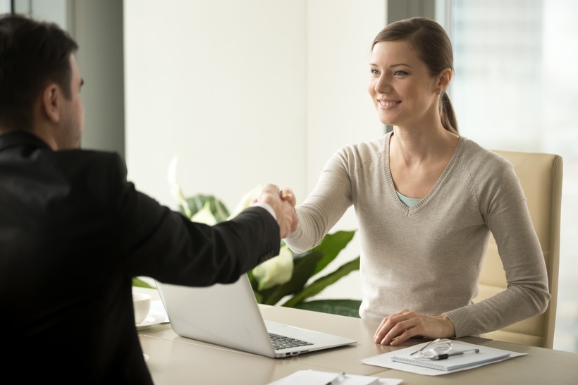 Recruiter shaking hand of candidate