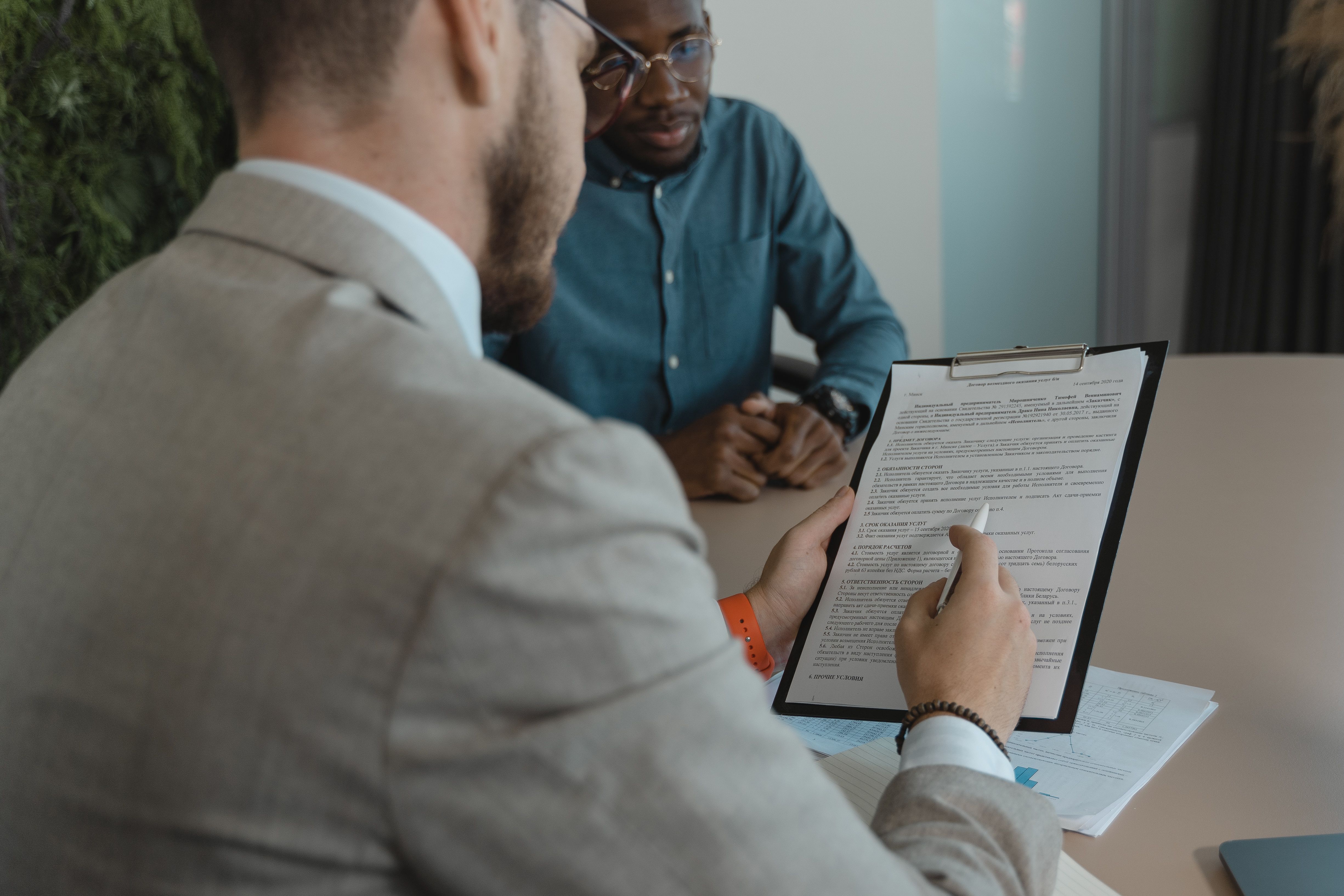Recruiter reviewing candidate documents with a worker across the desk